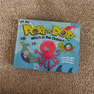 Poke a dot Who’s in the ocean kids board book